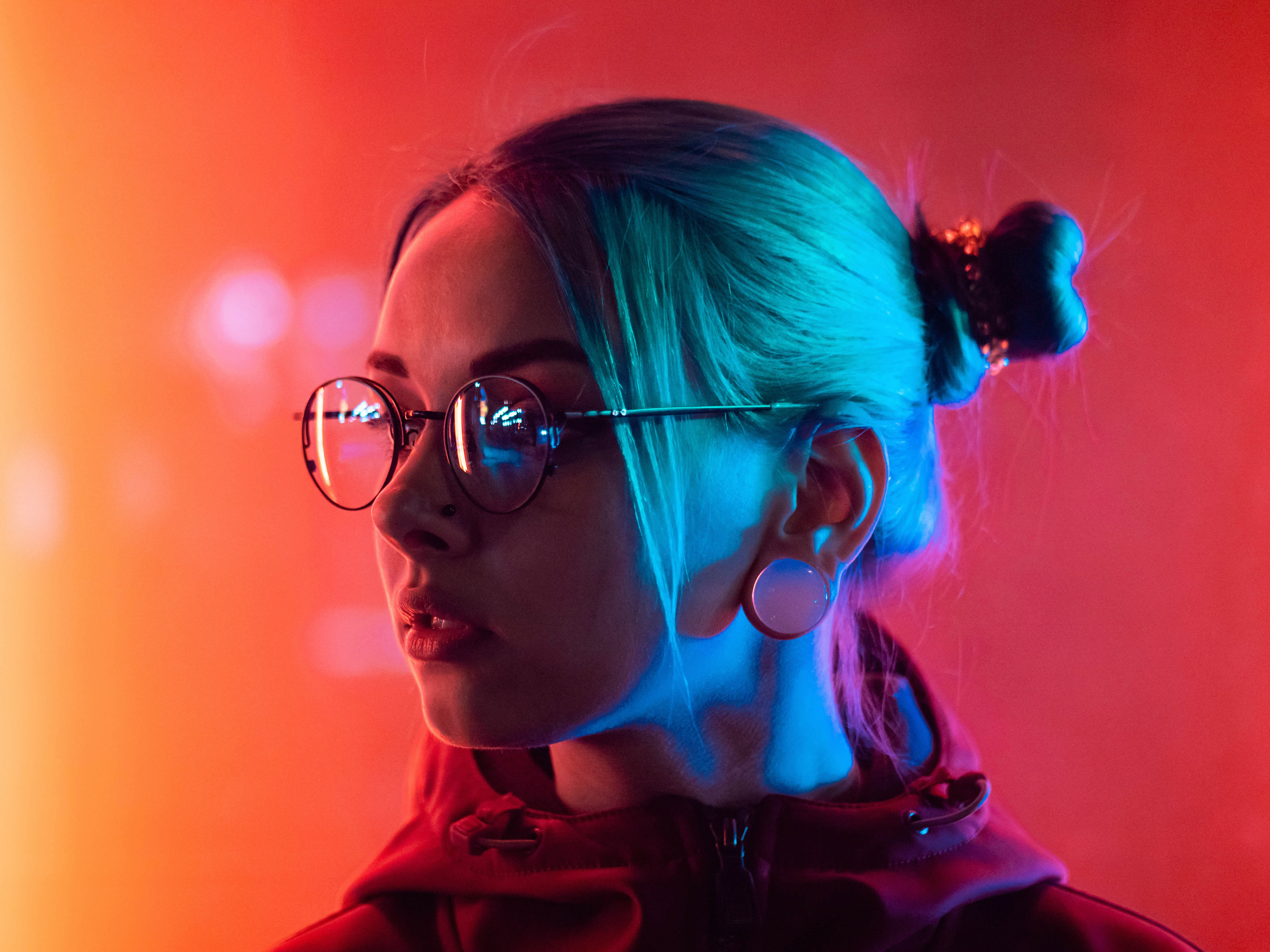 image of a woman wearing glasses and hair in bun